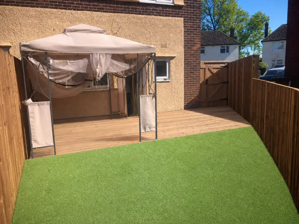 Completed LB Services garden with timber decking and a low-maintenance lawn
