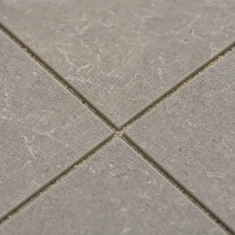Close detail of warm grey porcelain paving joints