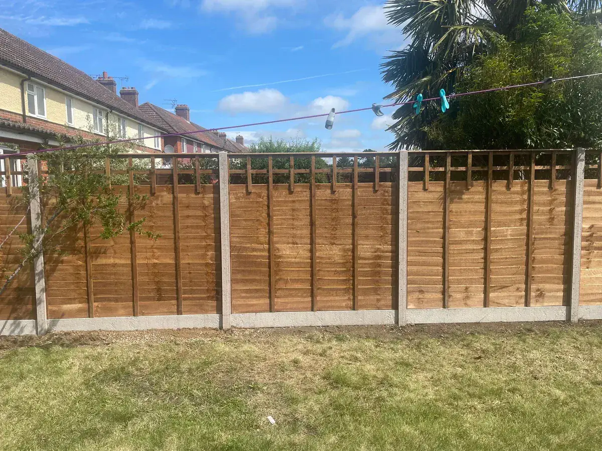 Completed timber garden fencing with concrete posts and gravel boards
