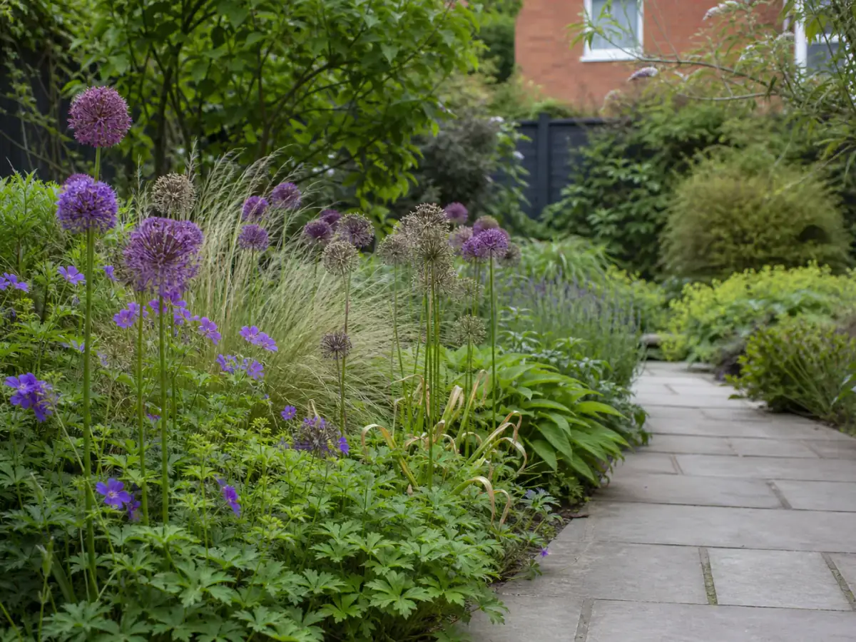 A maintained planted border beside a garden path at a UK home